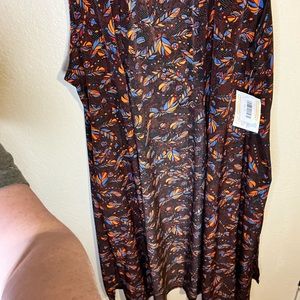 Feathers lularoe joy duster vest.